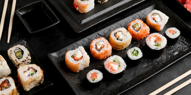 flat-lay-delicious-sushi-with-sauce